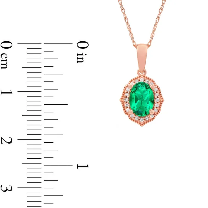 Necklaces Goldia Oval Emerald and 005 CT TW Natural Diamond Quatrefoil Frame Antique VintageStyle Pendant in 10K Rose Gold Necklaces Goldia Oval Emerald and 005 CT TW Natural Diamond Quatrefoil Frame Antique VintageStyle Pendant in 10K Rose Gold