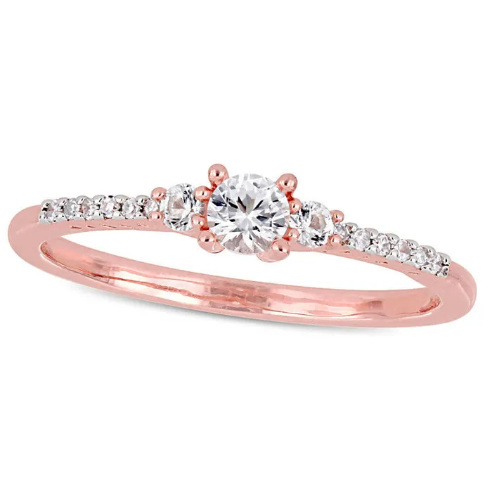 Rings Goldia 35mm LabCreated White Sapphire and 005 CT TW Diamond Three Stone Promise Ring in Sterling Silver with Rose Rhodium Rings Goldia 35mm LabCreated White Sapphire and 005 CT TW Diamond Three Stone Promise Ring in Sterling Silver with Rose Rhodium